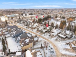 Snowy aerial view featuring a residential view - 