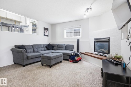 2916 31 Street, Edmonton, AB - Indoor Photo Showing Living Room With Fireplace