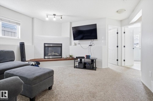 2916 31 Street, Edmonton, AB - Indoor Photo Showing Living Room With Fireplace