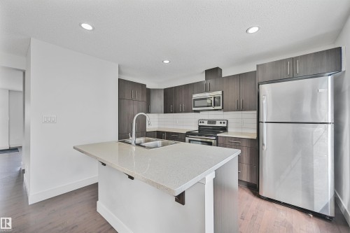35 2922 Maple Way, Edmonton, AB - Indoor Photo Showing Kitchen With Stainless Steel Kitchen With Double Sink With Upgraded Kitchen