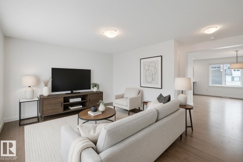 Virtually staged - 35 2922 Maple Way, Edmonton, AB - Indoor Photo Showing Living Room