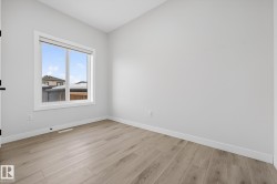 Unfurnished room featuring baseboards and light wood-style flooring - 