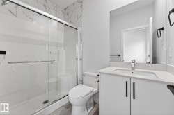 Full bathroom with a stall shower and vanity - 