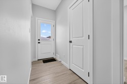 Entryway featuring wood finished floors and baseboards - 