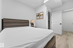 Bedroom with light wood-style floors - 