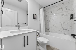 Bathroom with shower / bathtub combination with curtain and vanity - 