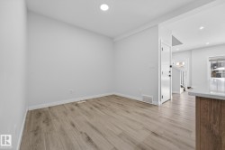 Spare room with light wood-style flooring and recessed lighting - 
