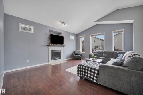 62 Douglas Crescent, Leduc, AB - Indoor Photo Showing Living Room With Fireplace
