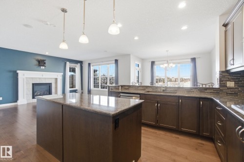1220 Secord Landing Landing, Edmonton, AB - Indoor Photo Showing Kitchen With Fireplace