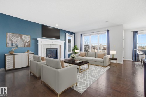 1220 Secord Landing Landing, Edmonton, AB - Indoor Photo Showing Living Room With Fireplace