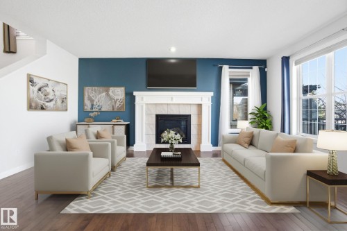 1220 Secord Landing Landing, Edmonton, AB - Indoor Photo Showing Living Room With Fireplace