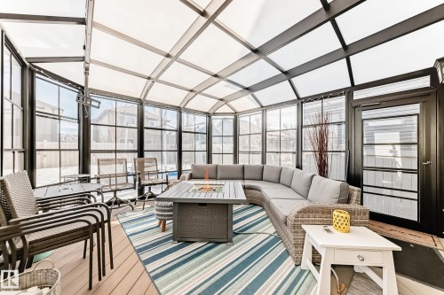 The property features a sunroom with a transparent roof and extensive windows, providing abundant natural light - 11 Etoile Cres N, St. Albert, AB - Indoor Photo Showing Other Room