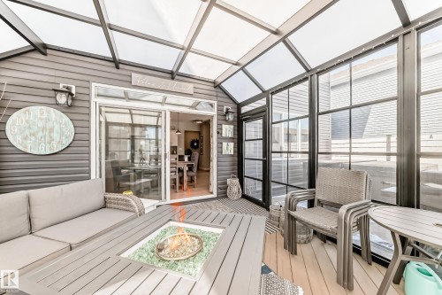 Enclosed sunroom featuring a transparent roof, large windows, and a sliding glass door providing external access - 11 Etoile Cres N, St. Albert, AB -  With Deck Patio Veranda With Exterior