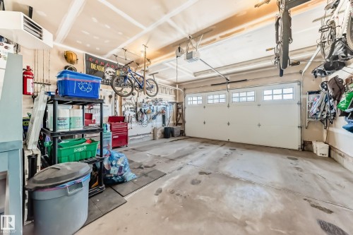 The property features a garage with a white garage door, which includes upper window panels - 11 Etoile Cres N, St. Albert, AB - Indoor Photo Showing Garage