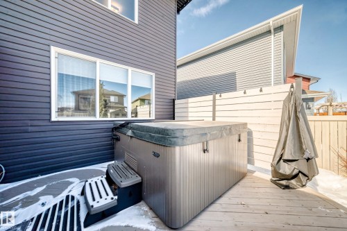 The property features a private deck with a hot tub, providing an outdoor relaxation area - 11 Etoile Cres N, St. Albert, AB - Outdoor With Exterior