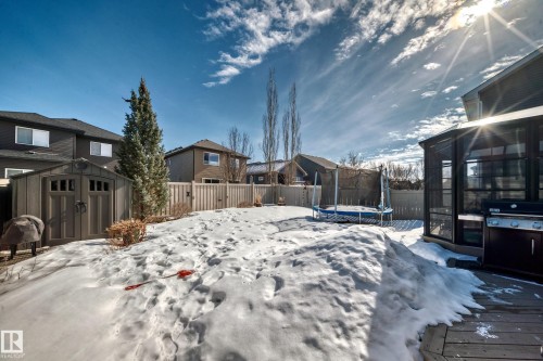 The property features an extensive backyard with a wooden fence, a shed, and a deck - 11 Etoile Cres N, St. Albert, AB - Outdoor