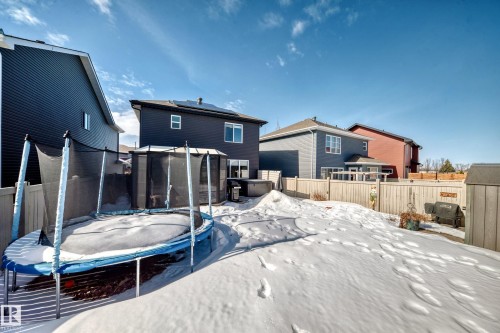 The property features a fenced yard with a shed and a paved patio area - 11 Etoile Cres N, St. Albert, AB - Outdoor With Exterior