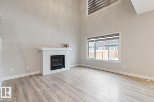1424 29 Street, Edmonton, AB - Indoor Photo Showing Other Room With Fireplace