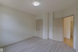 Unfurnished bedroom featuring light wood-type flooring and a closet - 