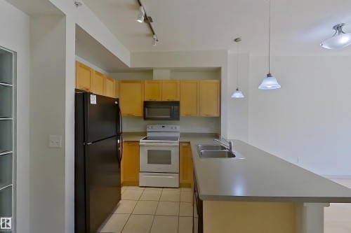 1-518 4245 139 Avenue, Edmonton, AB - Indoor Photo Showing Kitchen With Double Sink