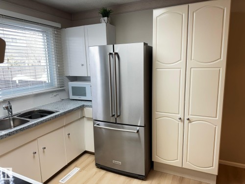 14315 58 Street, Edmonton, AB - Indoor Photo Showing Kitchen With Double Sink