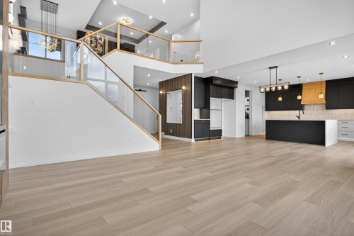 Open-concept interior featuring light wood-finish flooring throughout - 63 Jubilation Drive, St. Albert, AB - Indoor Photo Showing Other Room