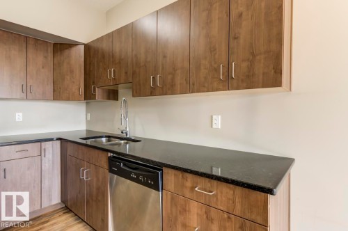 515 10518 113 Street, Edmonton, AB - Indoor Photo Showing Kitchen With Double Sink