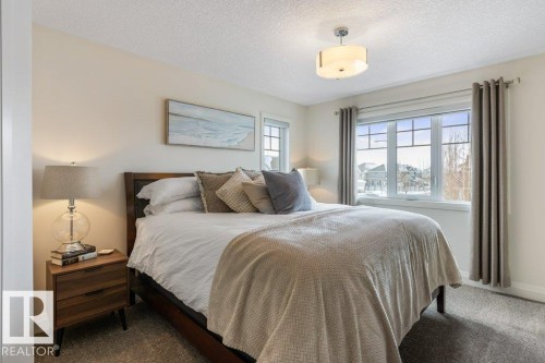 Bedroom featuring South West Facing Windows, and Walk In Closet - 4476 Suzanna Crescent, Edmonton, AB - Indoor Photo Showing Office