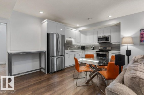 Basement Kitchen (Third Kitchen in the House) featuring Stainless Steel Appliances, White Cabinets, White Quartz Counters, and Tile Backsplash - 4476 Suzanna Crescent, Edmonton, AB - Indoor Photo Showing Kitchen With Upgraded Kitchen