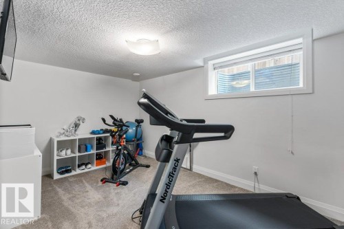 Two of Two Basement Bedrooms - 4476 Suzanna Crescent, Edmonton, AB - Indoor Photo Showing Gym Room