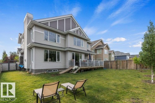 Summer View of the Back Exterior of the home featuring Deck,  and fenced yard space - 4476 Suzanna Crescent, Edmonton, AB - Outdoor With Deck Patio Veranda