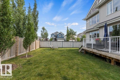 Summer View of South East Backyard - 4476 Suzanna Crescent, Edmonton, AB - Outdoor With Deck Patio Veranda