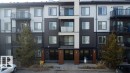 The property features a multi-story building with a modern facade, including balconies with dark railings - 429 390 Windermere Rd, Edmonton, AB  - Outdoor With Balcony With Facade 