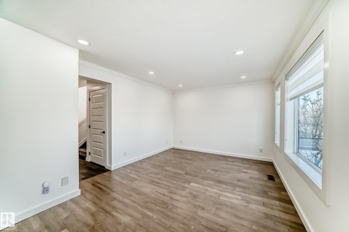 Unfurnished room with crown molding, recessed lighting, and light wood finished floors - 4008 37 Avenue, Edmonton, AB - Indoor Photo Showing Other Room