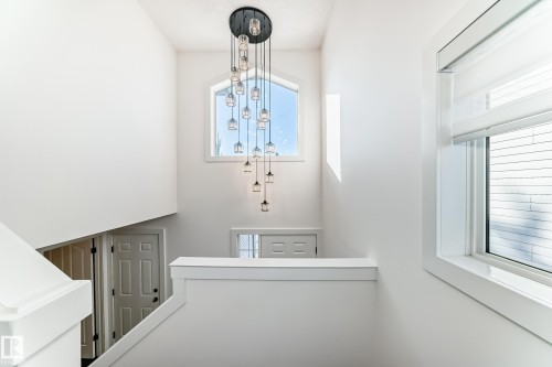 Stairway with plenty of natural light - 4008 37 Avenue, Edmonton, AB - Indoor Photo Showing Laundry Room