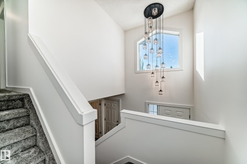 Stairs featuring healthy amount of natural light - 4008 37 Avenue, Edmonton, AB - Indoor Photo Showing Other Room