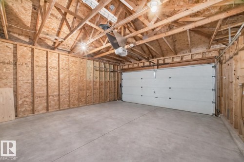 Garage featuring a garage door opener - 4008 37 Avenue, Edmonton, AB - Indoor Photo Showing Garage