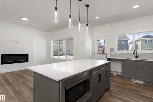 4028 207 Street, Edmonton, AB - Indoor Photo Showing Kitchen With Fireplace