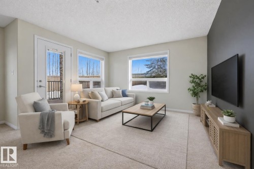 125 1520 Hammond Gate Nw, Edmonton, AB - Indoor Photo Showing Living Room