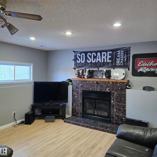 4016 22 Avenue, Edmonton, AB - Indoor Photo Showing Living Room With Fireplace
