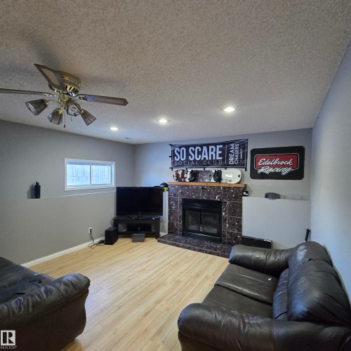 4016 22 Avenue, Edmonton, AB - Indoor Photo Showing Basement With Fireplace