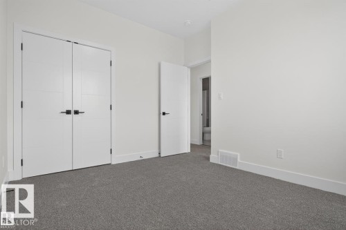 This room features grey carpeting, white walls, and white trim - 5 Rosa Crescent, St. Albert, AB - Indoor Photo Showing Other Room