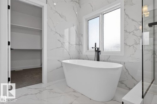 Bathroom featuring a freestanding tub, a window with frosted glass, and a walk-in shower with a glass enclosure - 5 Rosa Crescent, St. Albert, AB - Indoor Photo Showing Bathroom