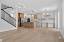 Open concept living area featuring light-toned hardwood flooring throughout - 11 Redbud Way, St. Albert, AB  - Indoor Photo Showing Kitchen 