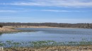 Waterfront property featuring a broad expanse of water, surrounding dry grassland, and a distant tree line - 11 Twin Lakes Drive, Rural Lamont County, AB 