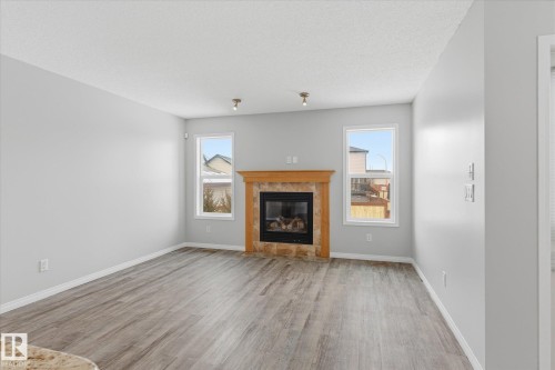 424 Songhurst Place, Leduc, AB - Indoor Photo Showing Living Room With Fireplace