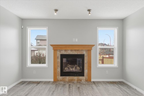 424 Songhurst Place, Leduc, AB - Indoor Photo Showing Living Room With Fireplace