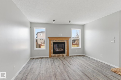 424 Songhurst Place, Leduc, AB - Indoor Photo Showing Living Room With Fireplace