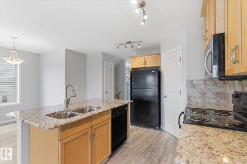 424 Songhurst Place, Leduc, AB - Indoor Photo Showing Kitchen With Double Sink