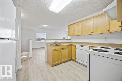 34 1179 Summerside Drive, Edmonton, AB - Indoor Photo Showing Kitchen With Double Sink